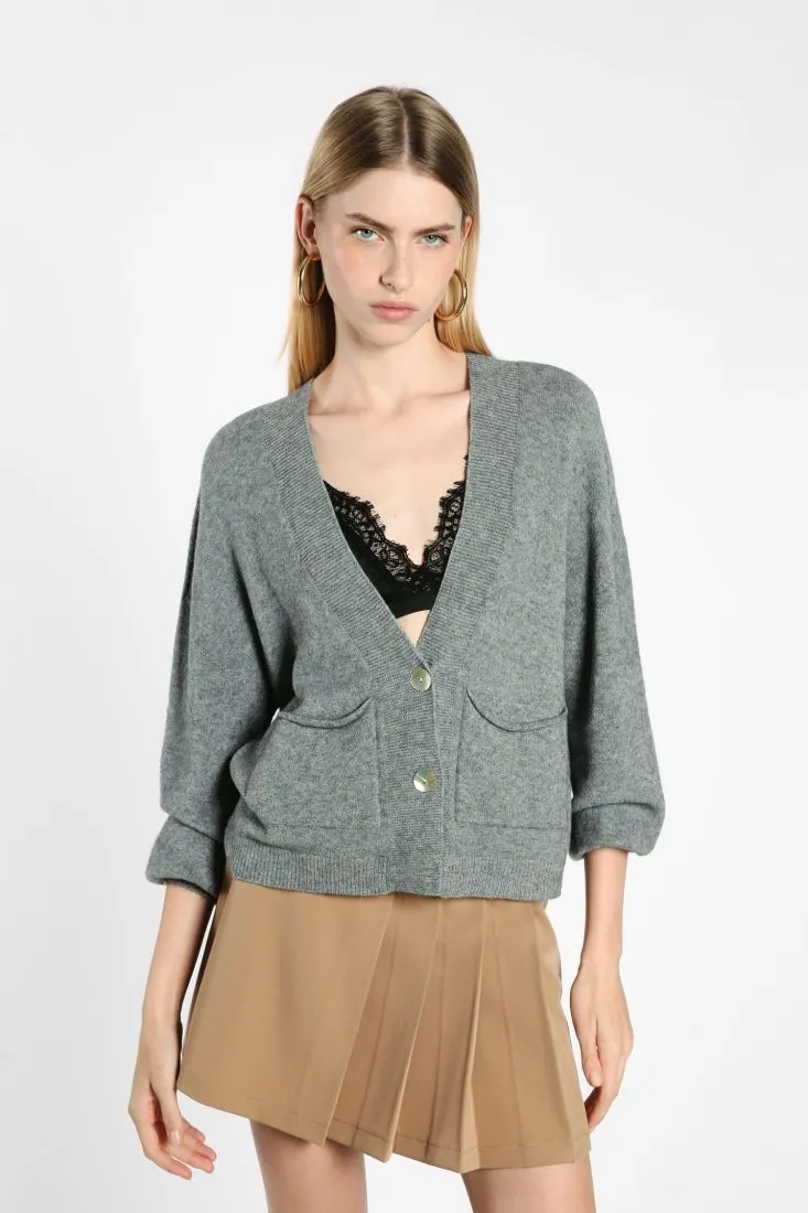 Cardigan oversize monocolour con abbottonatura e tasche applicate