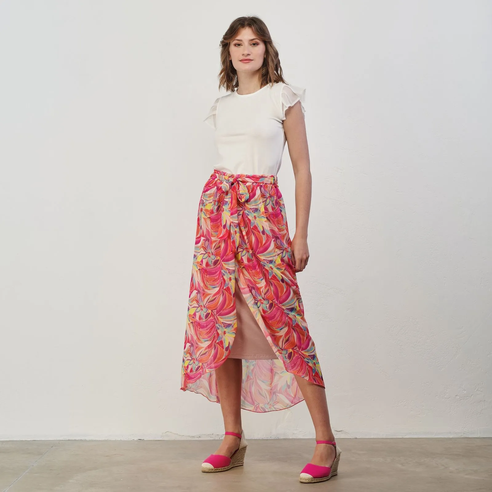 Gonna fucsia con stampa multicolor e spacco