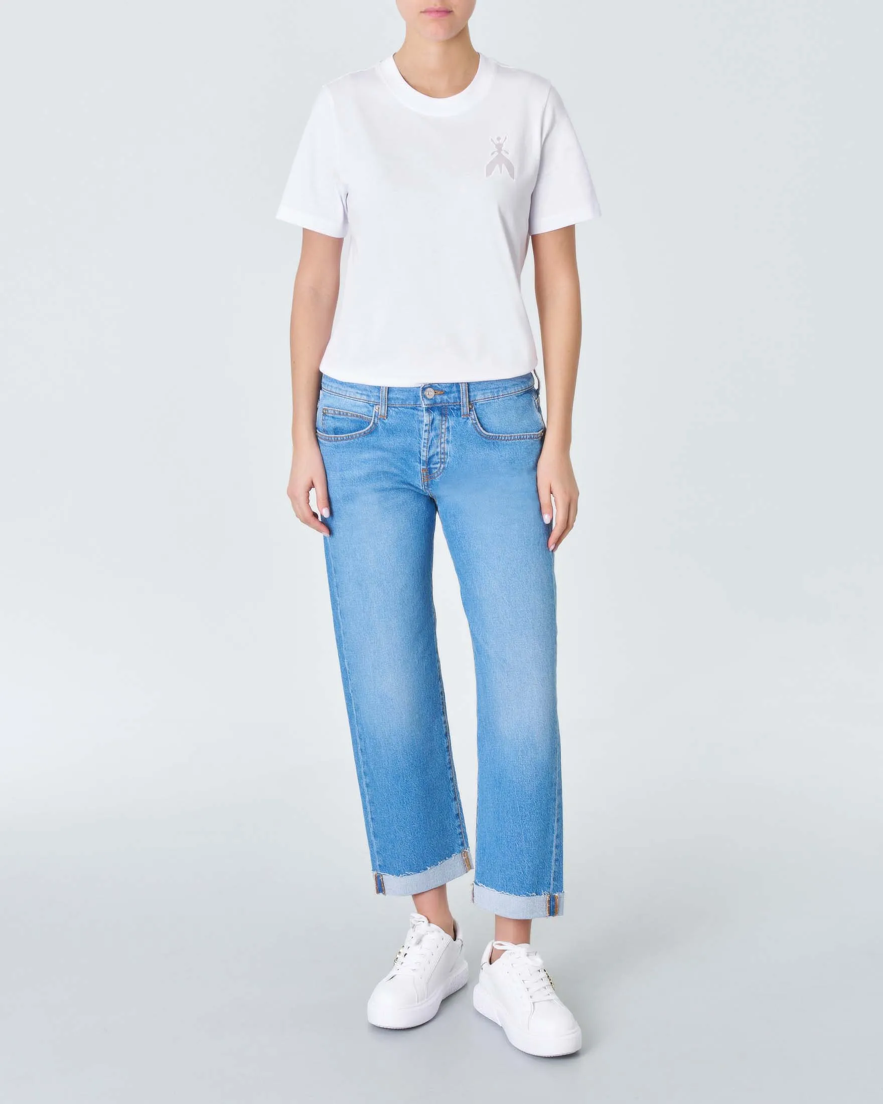 Jeans straight a vita bassa in cotone lavaggio chiaro super stone washed con risvolti al fondo