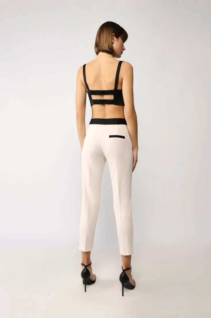Pantaloni cropped slim-fit con fascia in vita a contrasto