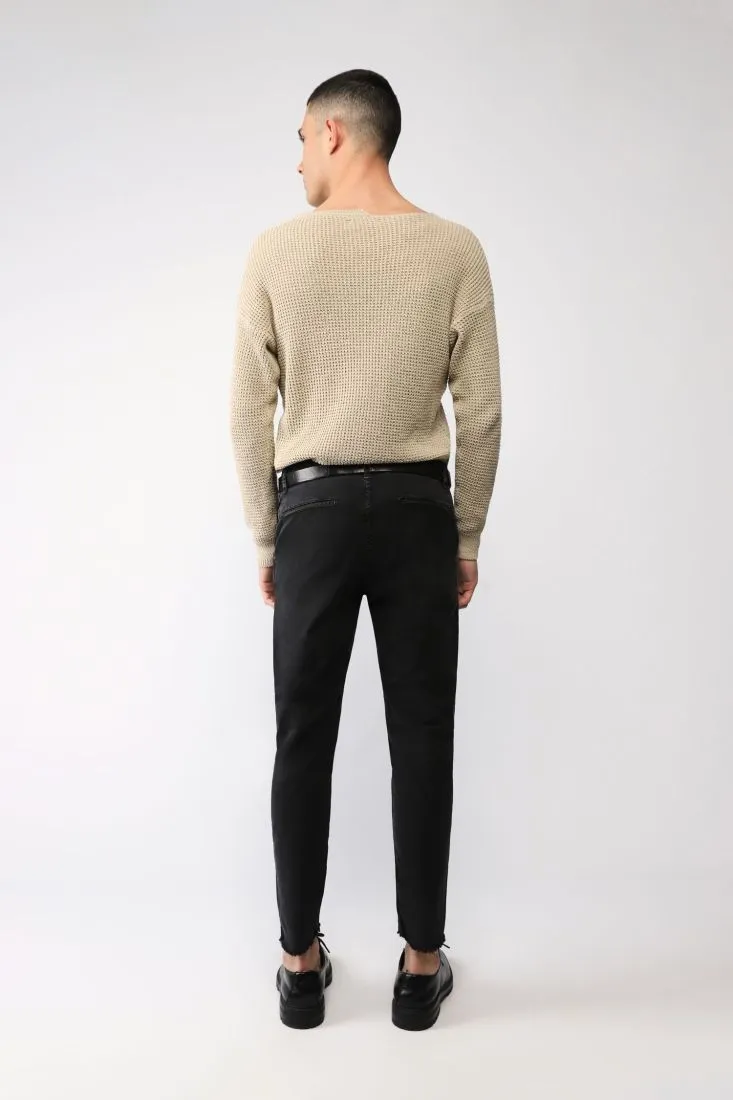 Pantaloni slim-fit con abrasioni e orli al vivo