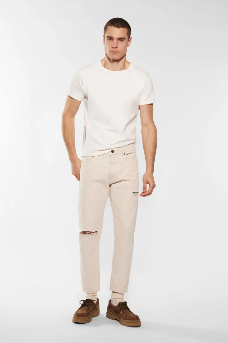 Pantaloni slim-fit in puro cotone monocolour con abrasioni
