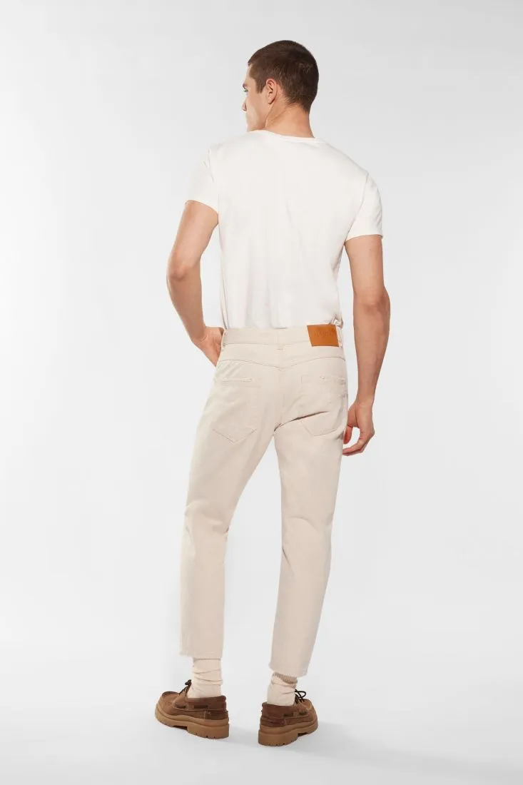 Pantaloni slim-fit in puro cotone monocolour con abrasioni