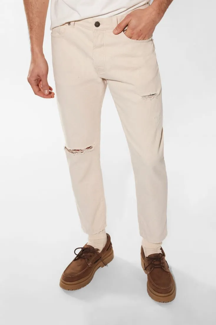 Pantaloni slim-fit in puro cotone monocolour con abrasioni